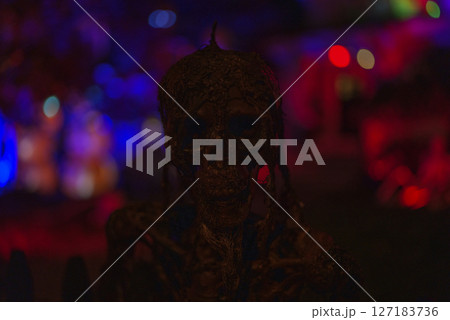 Terrifying Halloween Zombie Figure in Dark Spooky Lighting 127183736