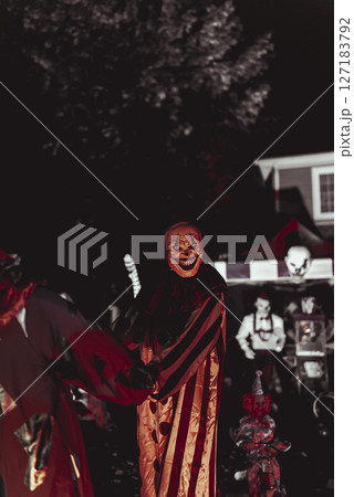 Creepy Halloween Clown Scene with Kissing Booth and Carnival Setup Creepy Halloween Clown Scene with Kissing Booth and Carnival Setup 127183792