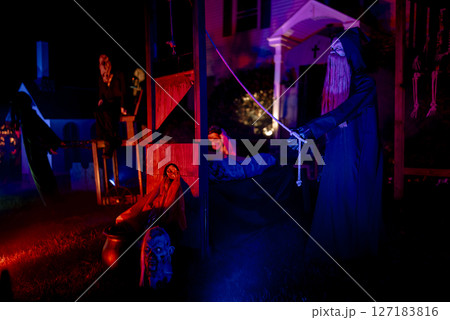 Spooky Halloween Yard Display with Skeletons, Pumpkins, and Haunted Figures Spooky Halloween Yard Display with Skeletons, Pumpkins, and Haunted Figures 127183816