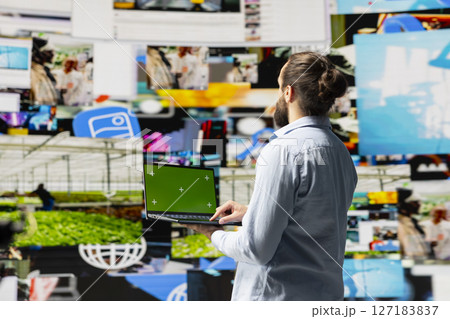 Social media manager uses device with isolated display for online presence, using his imagination and storytelling skills to connect with followers and boost online engagement. Modern web design. Social media manager uses device with isolated display for online presence, using his imagination and storytelling skills to connect with followers and boost online engagement. Modern web design. 127183837