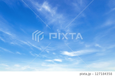 sky is blue and clear with  clouds 127184358
