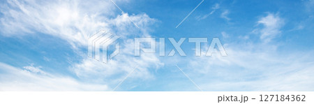 sky is blue and clear with clouds 127184362