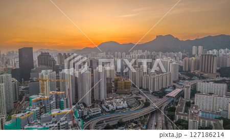 June 6 2025 Urban Cityscape at Sunset with Skyscrapers and Mountainous 127186214