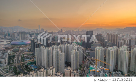 June 6 2025 Cityscape at Sunset Highlighting Skyscrapers and Distant Mountains 127186215