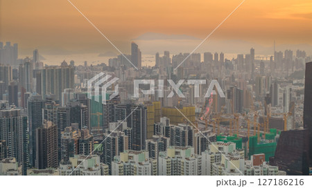 June 6 2025 Cityscape at Sunset Highlighting Skyscrapers and Distant Mountains 127186216