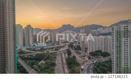 June 6 2025 Urban Cityscape at Sunset with Skyscrapers and Mountainous 127186225