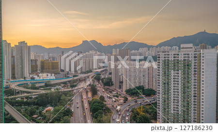 June 6 2025 Urban Cityscape at Sunset with Skyscrapers and Mountainous 127186230