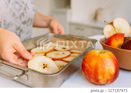 Preparing apples for drying 127187971