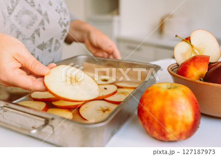 Preparing apples for drying 127187973