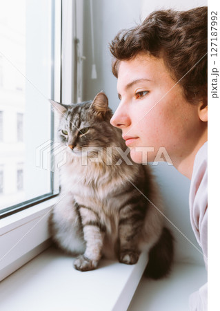 Portrait teenage girl and cat 127187992