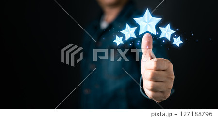 A stellar experience. Five glowing stars shine above a thumbs-up gesture, representing top tier quality, service, and customer satisfaction. A stellar experience. Five glowing stars shine above a thumbs-up gesture, representing top tier quality, service, and customer satisfaction. 127188796