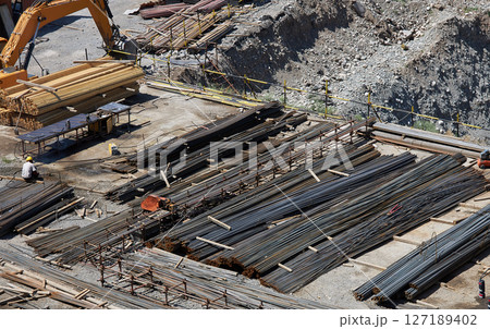 Construction site with materials for building construction, steel reinforcement 127189402