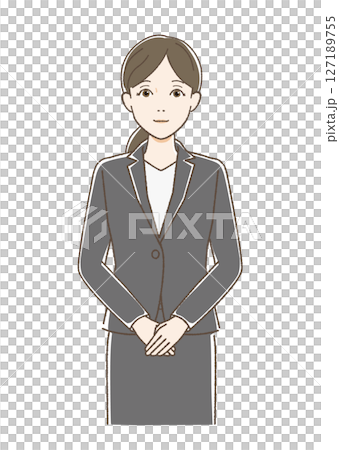 A woman in a suit standing facing forward and smiling A woman in a suit standing facing forward and smiling 127189755