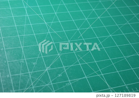 green cutting mat board background with line and scale measure guide pattern for object art design 127189819