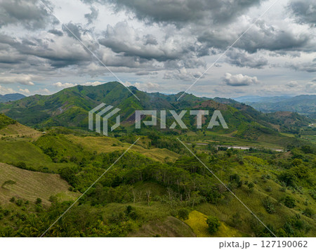 Mountains covered rainforest, trees and blue sky with clouds. Mindanao, Philippines 127190062