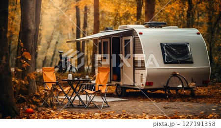 Forest Retreat: Cozy Trailer Camping in Autumn Setting. Generative ai 127191358