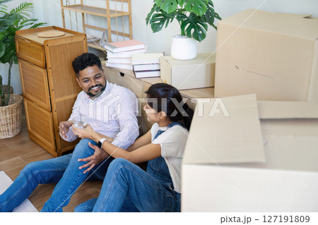 Married couple moving in new property bought together on mortgage loan Married couple moving in new property bought together on mortgage loan 127191809
