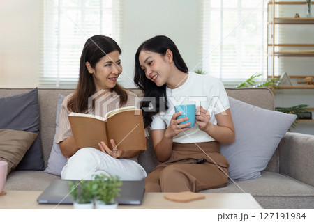 mature daughter and mother sitting together in the morning. mature daughter and retired mother spend weekend together mature daughter and mother sitting together in the morning. mature daughter and retired mother spend weekend together 127191984