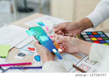 ux developer and UI designer team brainstorm together about designing application interface layout. Creative digital development agency. UX UI concept ux developer and UI designer team brainstorm together about designing application interface layout. Creative digital development agency. UX UI concept 127192157