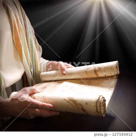 Man's hans holding a scroll Man's hans holding a scroll 127193912