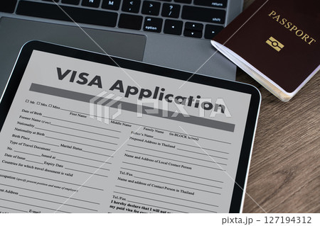 Visa application digital tablet displaying visa  127194312