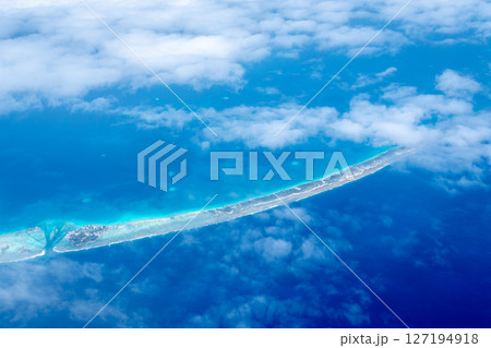 Aerial view of the Tuamotus atoll in French Polynesia with clouds 127194918