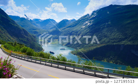 Fjord Geirangerfjord with ferry boat, Norway. Fjord Geirangerfjord with ferry boat, Norway. 127195513