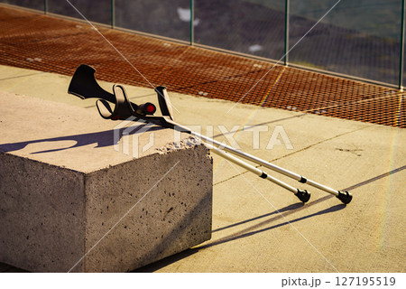 Crutches outdoor on bench. 127195519
