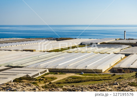 Plastic greenhouses on coast, Spain Plastic greenhouses on coast, Spain 127195576