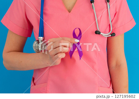 Female doctor in white uniform with purple awareness of ribbon in hand for ADD,ADHD,Alzheimer Disease ,Arnold Chiari Malformation,Childhood Hemiplegia stroke, Epilepsy, Chronic Acute Pain,Crohns 127195602