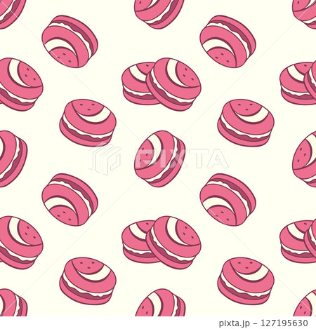 Creme pattern with pink macaroons. Strawberry delicious cookies with cream filling. 127195630
