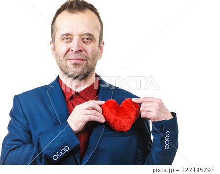 Man in suit holding heart 127195791