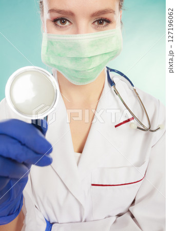 Specialist in mask with stethoscope. 127196062