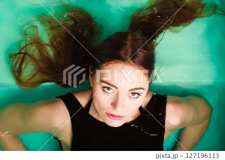 Portrait of sexy seductive woman in water. Portrait of sexy seductive woman in water. 127196113