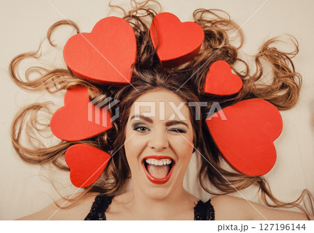 Woman in lingerie in bed. Valentines day love. Woman in lingerie in bed. Valentines day love. 127196144