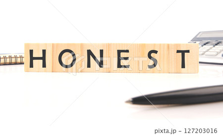 The concept word HONEST is assembled from cubes. Business integrity ethics honesty respect concept 127203016