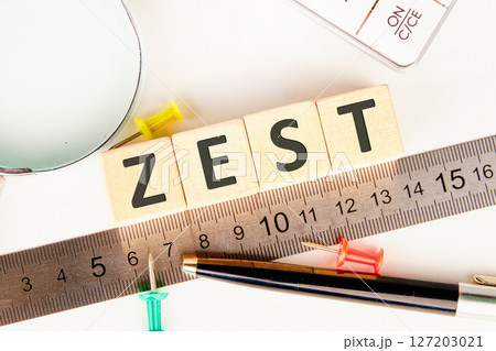 The concept word ZEST is assembled from wooden cubes. emphasizing motivation and creativity concept 127203021