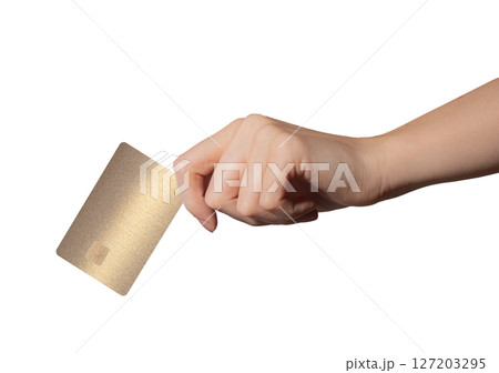 Bank card held in hand, showing glossy, shiny beige and golden surface. Electronic payment concept 127203295