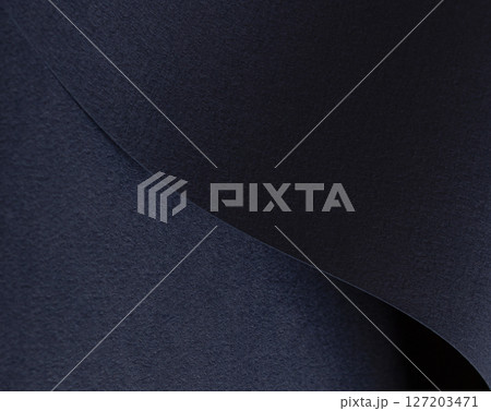Premium dark blue paper texture with a matte finish. Elegant, minimalistic abstract pattern creating 127203471