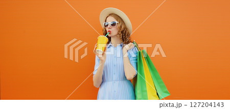 Fashion, shopping and clothing, beautiful relaxed young woman with colorful shopping bags Fashion, shopping and clothing, beautiful relaxed young woman with colorful shopping bags 127204143