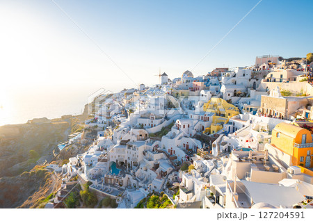 Santorini Oia village, Greece, showcases its iconic white architecture and stunning Aegean Sea views Santorini Oia village, Greece, showcases its iconic white architecture and stunning Aegean Sea views 127204591