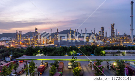 Oil and gas industrial refinery at night, Oil and gas refinery petrochemical plant pipeline steel, Oil and gas refinery factory oil and gas storage tank pipeline steel at night, Global energy refinery 127205145