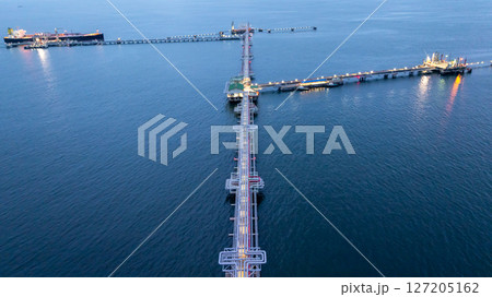 Aerial view LPG gas tanker ship at oil and gas terminal platform, Liquefied Petroleum Gas tanker ship industrial offshore oil gas terminal tanker ship LPG tanker ship loading arm loading and unloading Aerial view LPG gas tanker ship at oil and gas terminal platform, Liquefied Petroleum Gas tanker ship industrial offshore oil gas terminal tanker ship LPG tanker ship loading arm loading and unloading 127205162