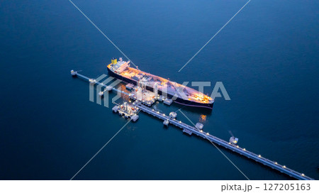 Aerial view LPG gas tanker ship at oil and gas terminal platform, Liquefied Petroleum Gas tanker ship industrial offshore oil gas terminal tanker ship LPG tanker ship loading arm loading and unloading 127205163
