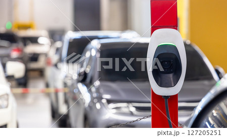 EV charging station electric car, Electric car charging station for charge EV battery, Plug for vehicle with electric engine, EV charger clean energy, Charging point at car parking lot. EV charging station electric car, Electric car charging station for charge EV battery, Plug for vehicle with electric engine, EV charger clean energy, Charging point at car parking lot. 127205251