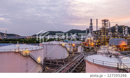 Oil and gas industrial refinery at night, Oil and gas refinery petrochemical plant pipeline steel, Oil and gas refinery factory oil and gas storage tank pipeline steel at night, Global energy refinery Oil and gas industrial refinery at night, Oil and gas refinery petrochemical plant pipeline steel, Oil and gas refinery factory oil and gas storage tank pipeline steel at night, Global energy refinery 127205266