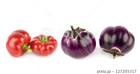 sweet peppers and Eggplants or aubergine vegetables isolated on white background. Collage. Wide photo. 127205317