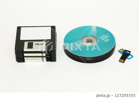 Floppy disks, CD / DVD disk and USB flash on a white background 127205355