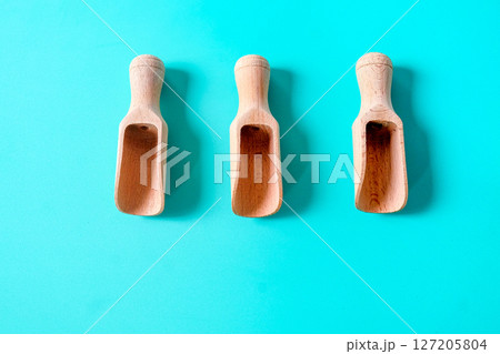 Wooden spoon, chopsticks and equipment on a color background. Top view. 127205804