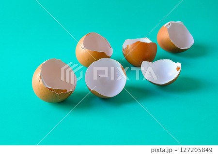 brown egg shell broken or crack on color background. 127205849